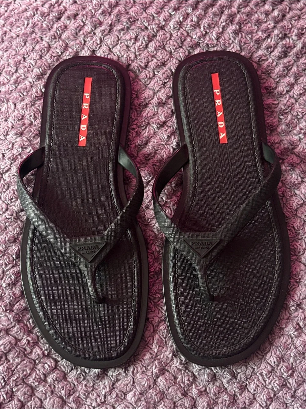 Prada Men’s Black Flip-Flop Sandals with Red Logo Accent